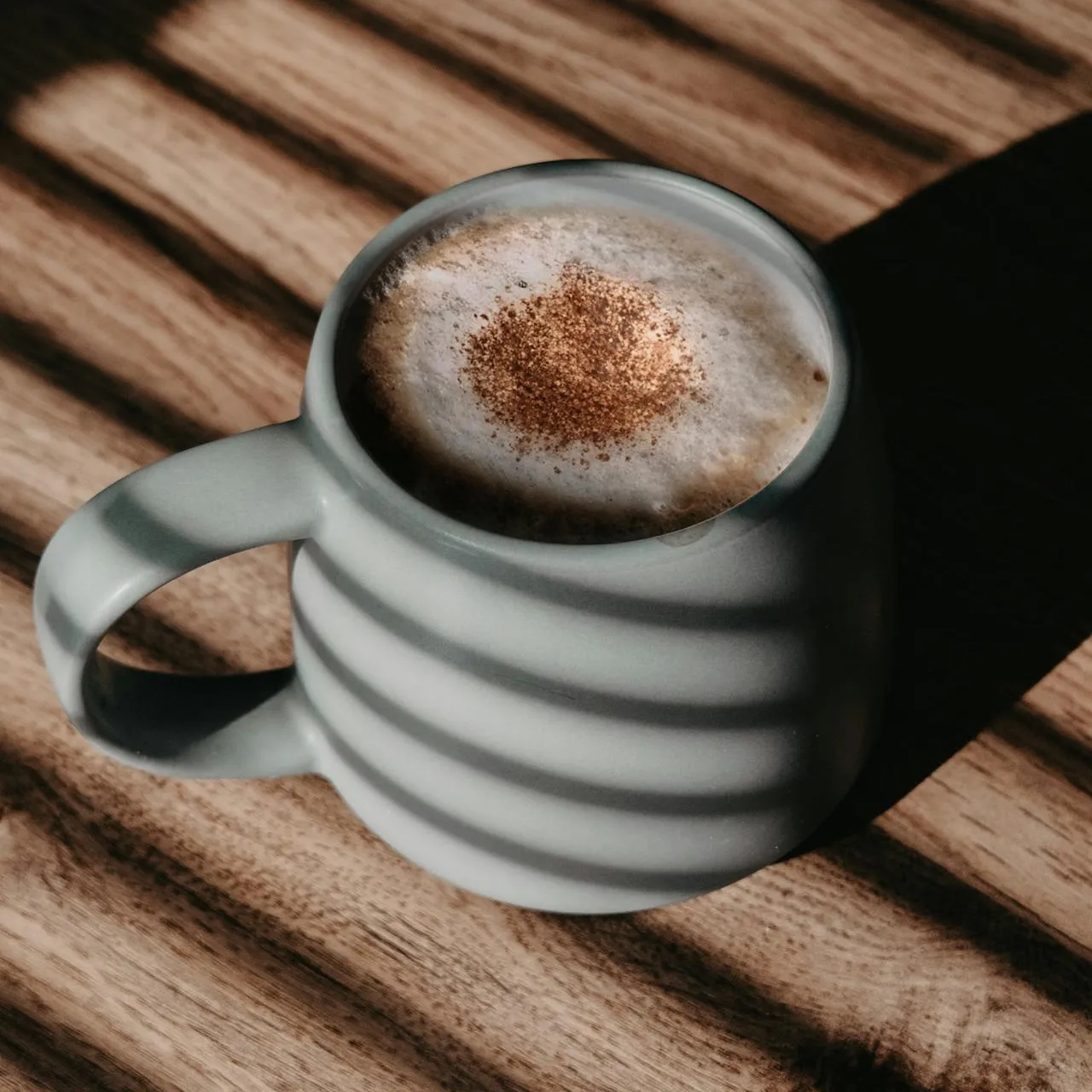 Cup of coffee in shadow
